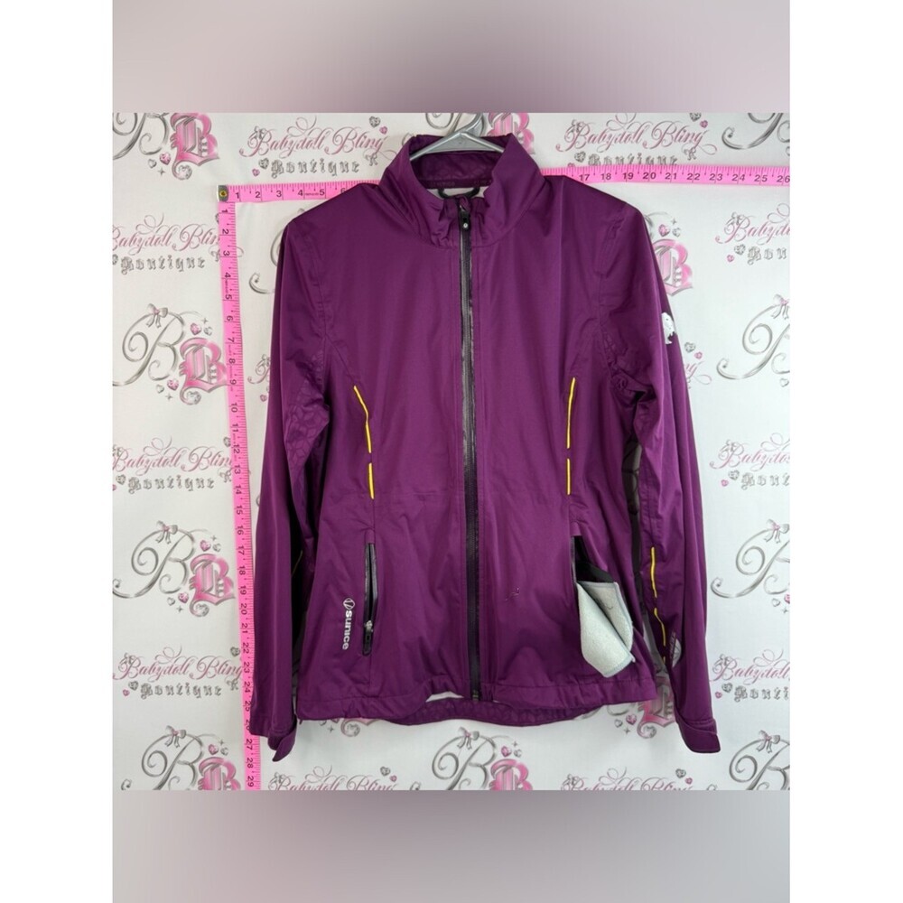 Sunice jacket lightweight fits in bag Purple Women's Jacket with Yellow Accents